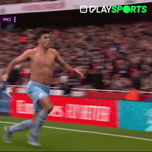 A Shirtless Soccer Player Is Running On A Field With A Playsports Logo In The Background GIF