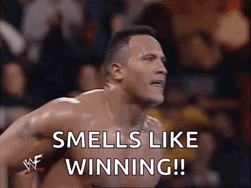 A Shirtless Wrestler Says Smells Like Winning In Front Of A Crowd GIF