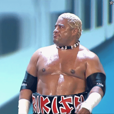 A Shirtless Wrestler Wearing A Belt That Says Rikishi On It GIF