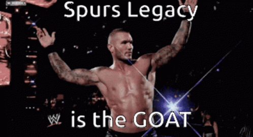 A Shirtless Wrestler With The Words Spurs Legacy Is The Goat On The Bottom GIF