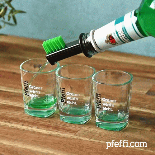 A Shot Glass With The Word Pfeffi On It GIF