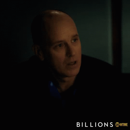 a showtime ad for billions features a bald man in a dark room