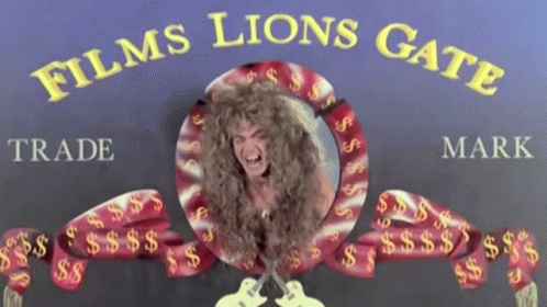 A Sign For Films Lions Gate With A Picture Of A Woman GIF