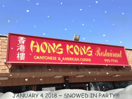 A Sign For The Hong Kong Restaurant Is Covered In Snow GIF