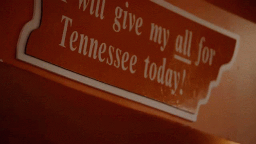 A Sign On A Wall That Says I Will Give My All For Tennessee Today GIF