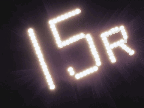 A Sign That Says 15R Is Lit Up In The Dark GIF