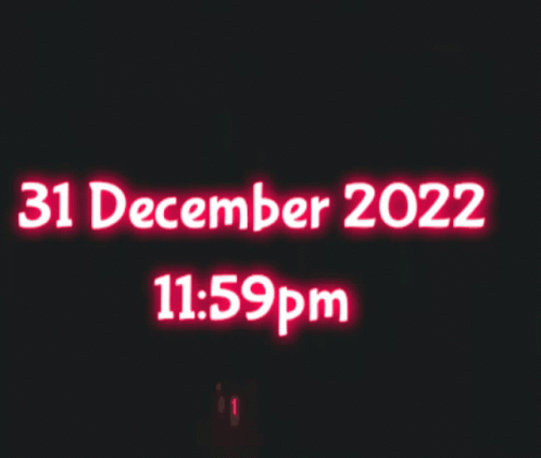 A Sign That Says 31 December 2022 And 11:59 Pm GIF