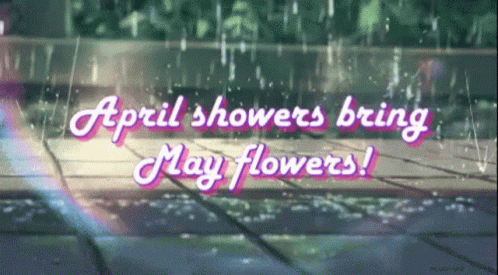 A Sign That Says April Showers Bring May Flowers On A Rainy Day GIF