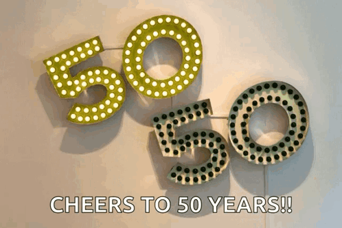 A Sign That Says Cheers To 50 Years Is Hanging On A Wall GIF