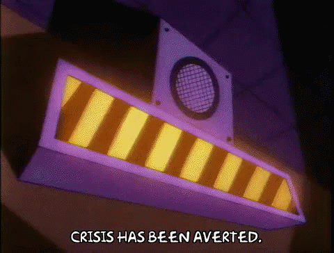 A Sign That Says Crisis Has Been Averted In A Cartoon GIF