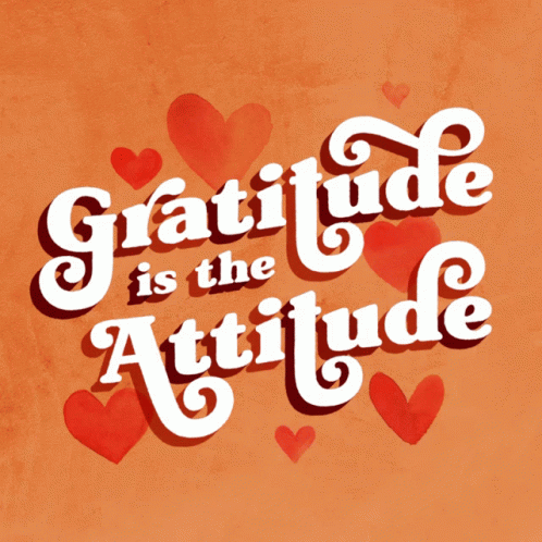 A Sign That Says Gratitude Is The Attitude With Hearts Around It GIF