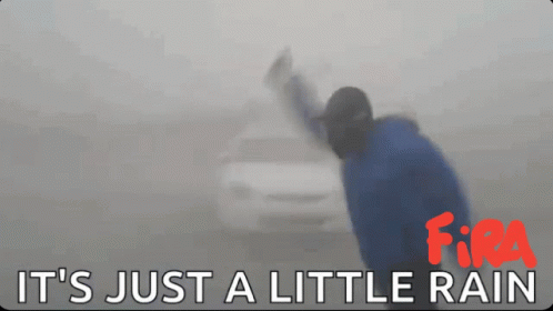 A Sign That Says It 'S Just A Little Rain With A Car In The Background GIF