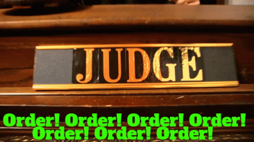 A Sign That Says Judge On It In Gold GIF