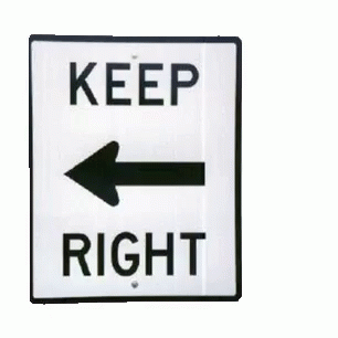A Sign That Says Keep Right With An Arrow Pointing To The Left GIF