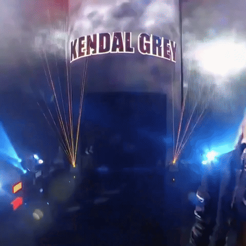 a sign that says kendal grey is lit up with blue lights