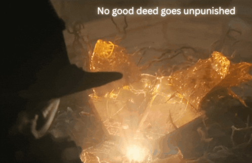 A Sign That Says No Good Deed Goes Unpunished In Front Of A Fire GIF