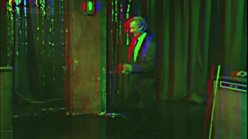 A Sign That Says " Remain Indoors " In White Letters GIF