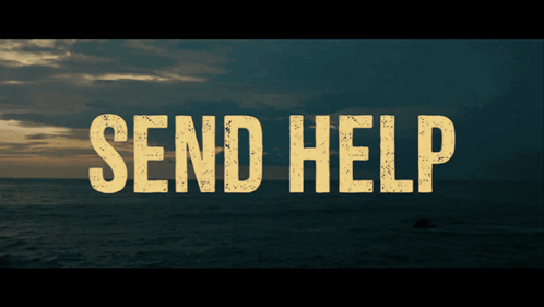 a sign that says send help on it in front of the ocean
