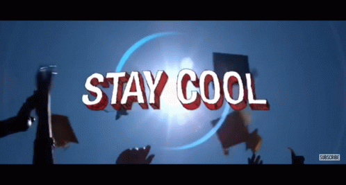 a sign that says " stay cool " is surrounded by people holding signs