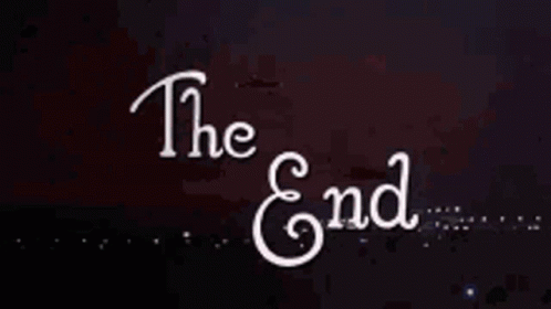 A Sign That Says The End With A Firework In The Background GIF