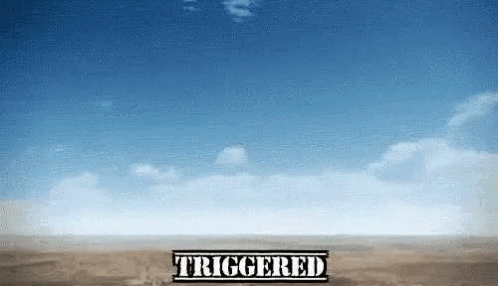A Sign That Says Triggered On It In Front Of A Blue Sky GIF