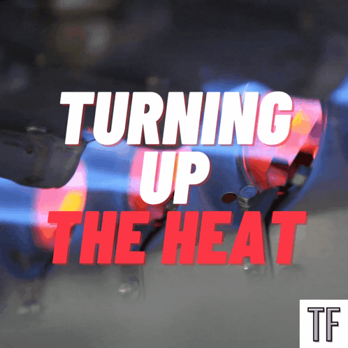 A Sign That Says Turning Up The Heat With A Car In The Background GIF