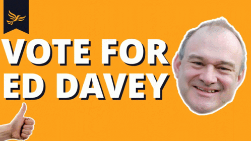 A Sign That Says Vote For Ed Davey With A Picture Of A Man Giving A Thumbs Up GIF