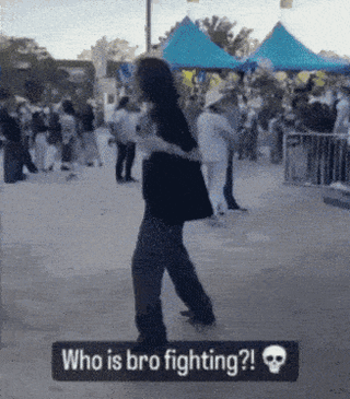 a sign that says who is bro fighting in front of a crowd