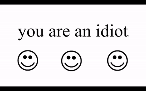 A Sign That Says You Are An Idiot With Three Smiley Faces On It GIF