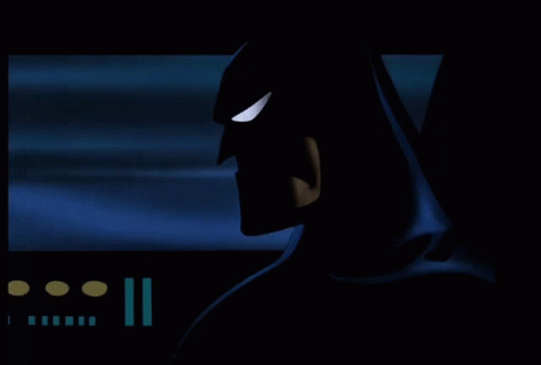 A Silhouette Of A Batman With A Blue Background GIF