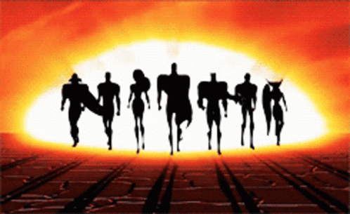 A Silhouette Of A Group Of People Standing In Front Of A Large Explosion GIF