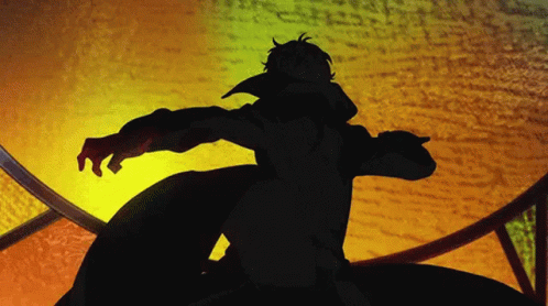 A Silhouette Of A Man In A Black Coat Is Standing In Front Of A Yellow Background GIF