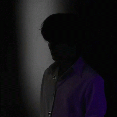 A Silhouette Of A Man 'S Face With A Blue Light Coming From His Head . GIF