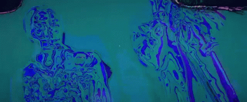 A Silhouette Of A Man Standing In Front Of A Microphone On A Red And Yellow Background . GIF