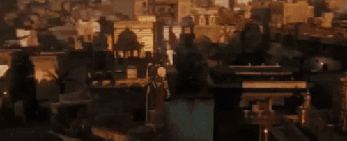 A Silhouette Of A Man Standing In Front Of A Sunset . GIF