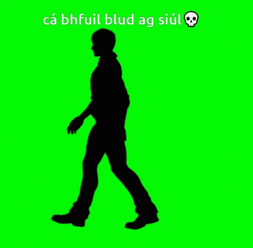 a silhouette of a man walking with the words ca bhful blud ag siul below him
