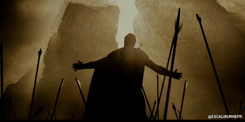 A Silhouette Of A Man With His Arms Outstretched And The Words Excaliburnefr Below GIF
