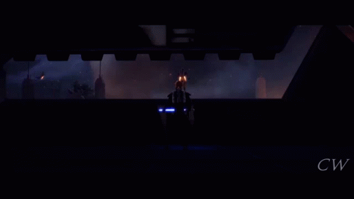 A Silhouette Of A Person Holding A Lightsaber In Front Of A Burning Building GIF