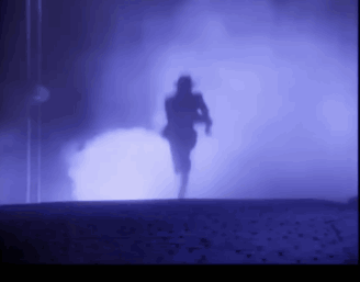 A Silhouette Of A Person In A Dark Room With Purple Lights GIF