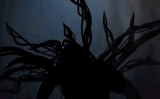 A Silhouette Of A Person In A Dark Room GIF
