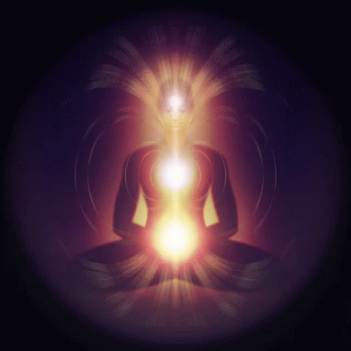 A Silhouette Of A Person In A Lotus Position With A Light Coming Out Of The Center GIF
