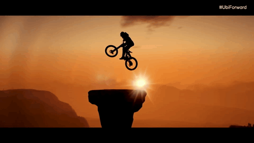 A Silhouette Of A Person On A Bike Jumping Over A Cliff With The Ubi Forward Logo In The Background GIF