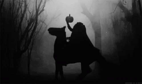 A Silhouette Of A Person Riding A Horse Holding A Pumpkin GIF