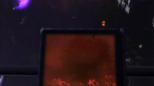 a silhouette of a person standing in a dark room with a red light behind them