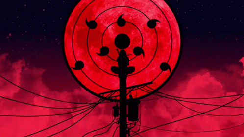 A Silhouette Of A Person Standing In Front Of A Full Moon GIF