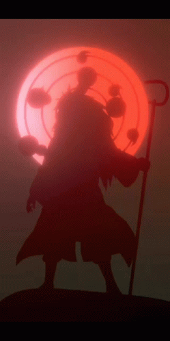 A Silhouette Of A Person With A Cane In Front Of A Red Sun GIF