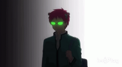 A Silhouette Of A Person With Green Eyes And Red Hair Standing In A Dark Room . GIF