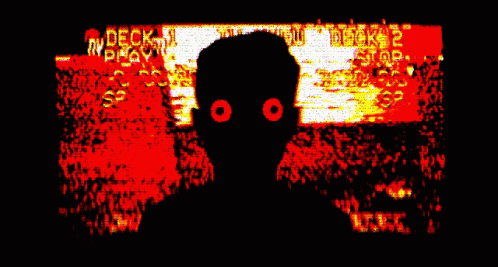 A Silhouette Of A Person With Red Eyes In Front Of A Screen That Says " Deck " GIF