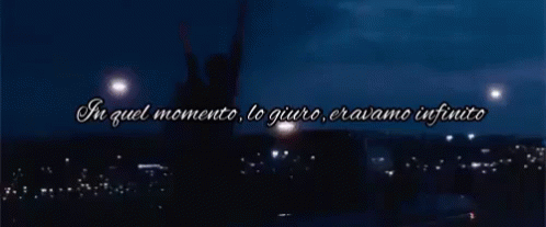 A Silhouette Of A Person With Their Arms In The Air And The Words In Quel Momento Lo Giuro Eravamo Infinito GIF