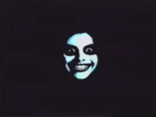 A Silhouette Of A Smiling Face With A Black Background GIF